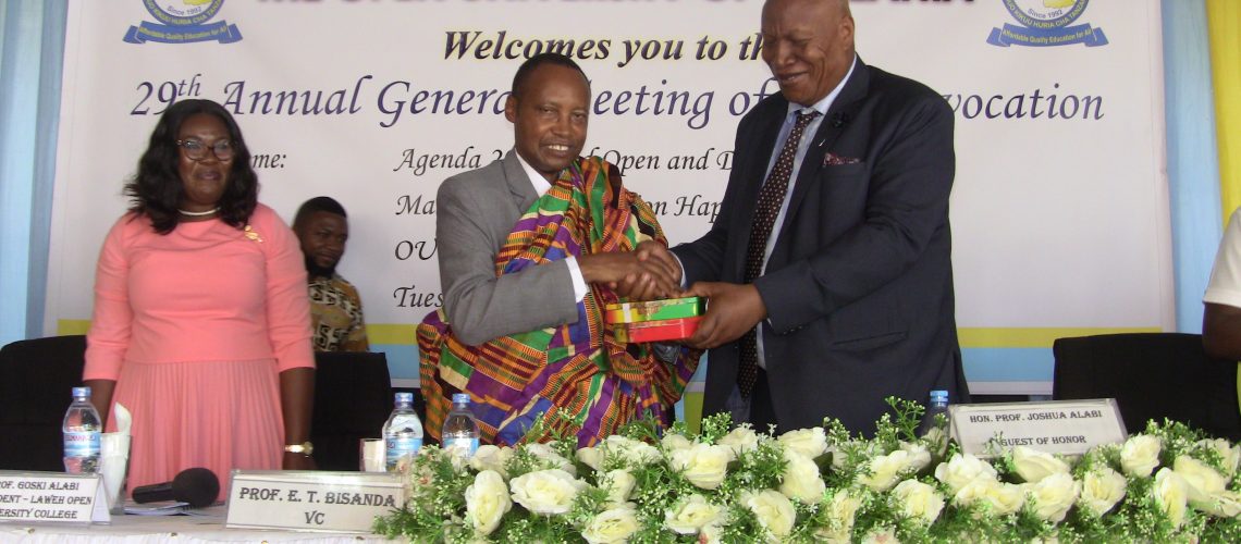 the-vice-chancellor-of-the-open-university-of-tanzania-prof-elifas-bisanda-receives-a-gift-from-the-president-of-laweh-open-university-of-accra-ghana-prof-joshua-alabi-during-the-29th-annual-gener